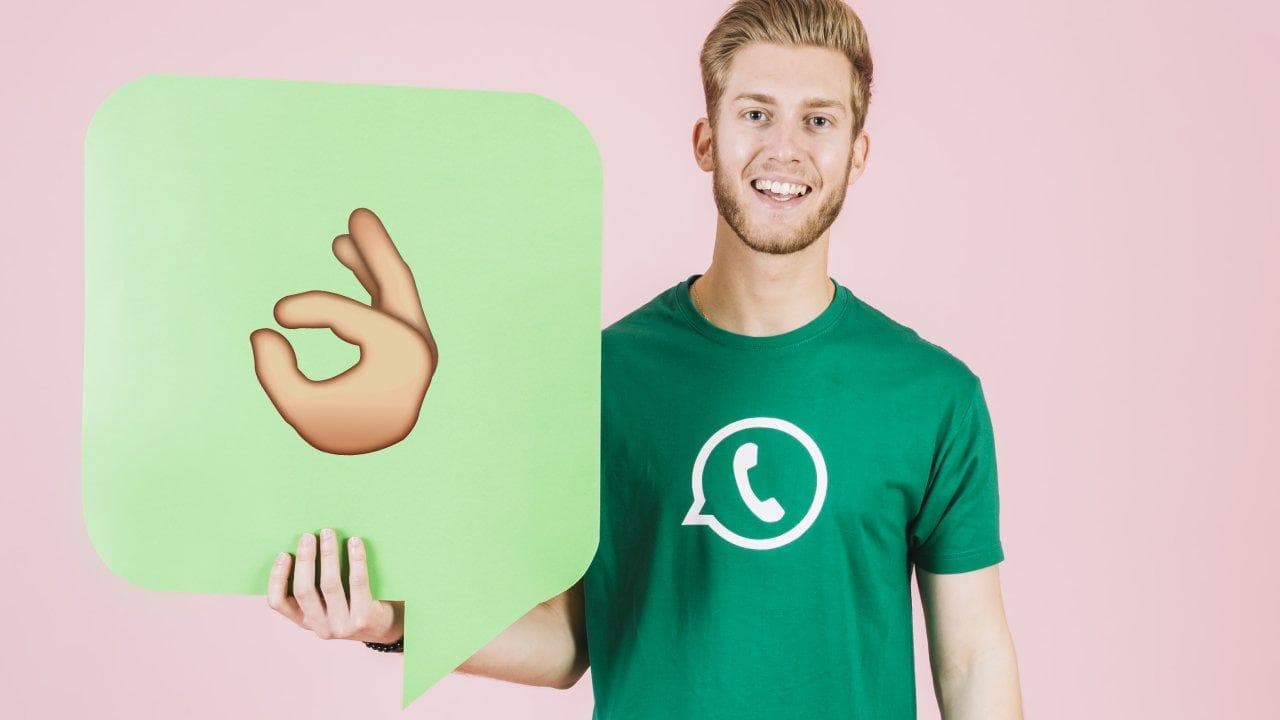 portrait smiling young man holding empty green speech bubble portrait smiling young man holding empty green speech bubble